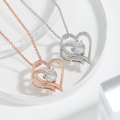 Dubbel hart gouden ketting met zirkonia