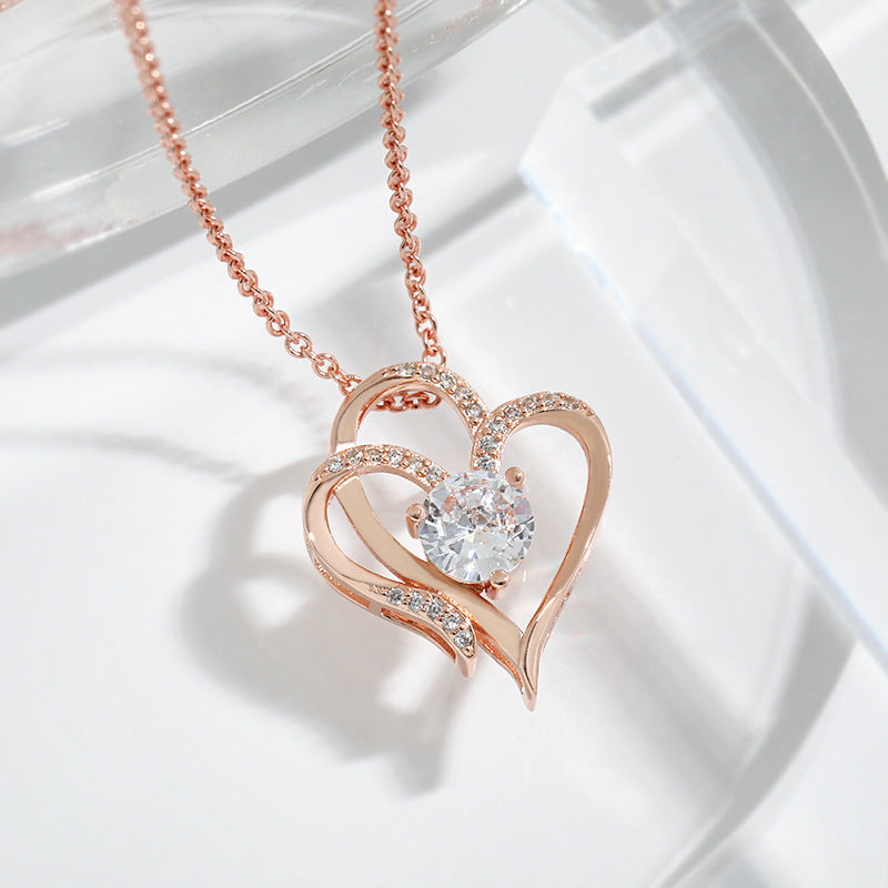 Dubbel hart gouden ketting met zirkonia